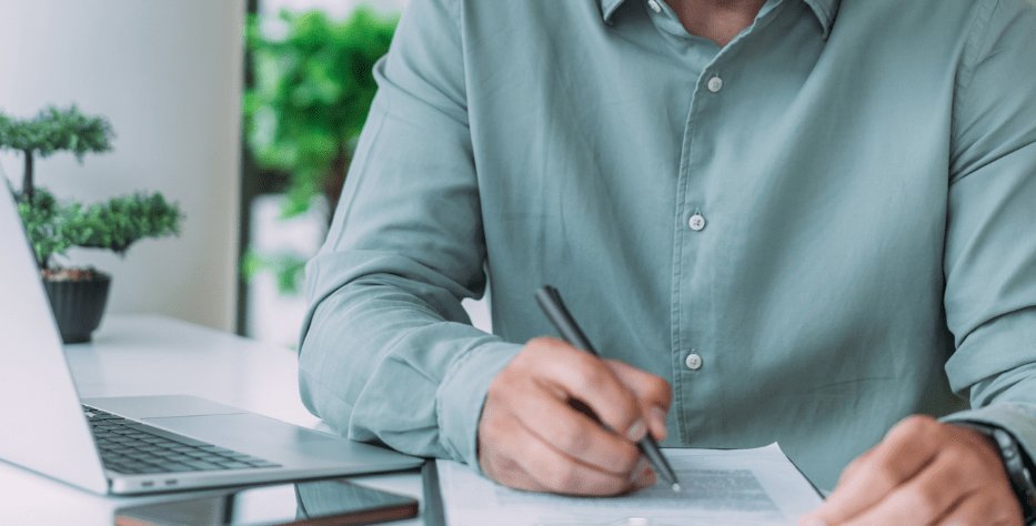 Photo of man filling out paperwork